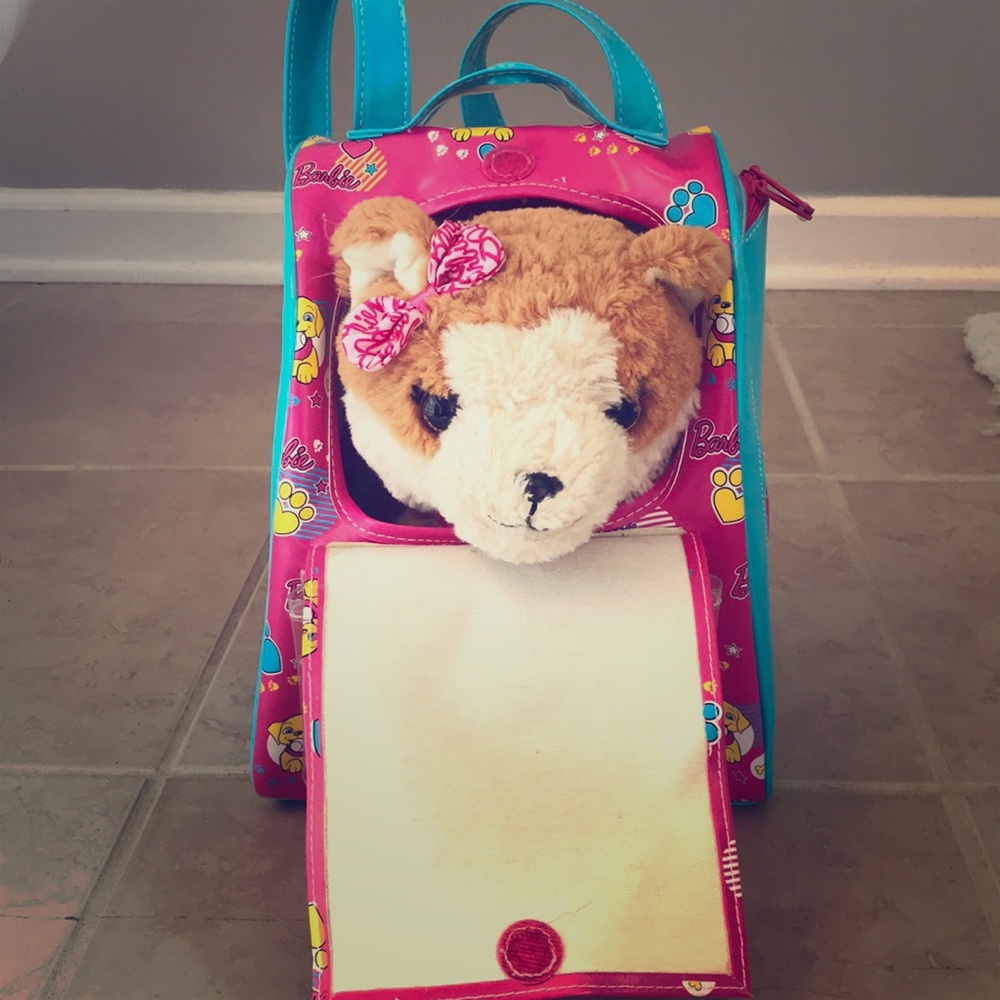 Barbie talking dog and carrying backpack toy.